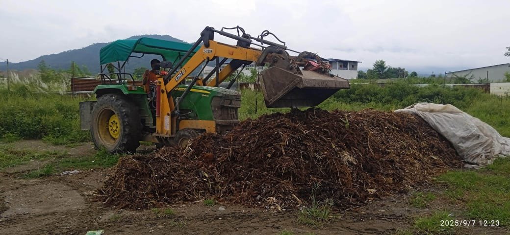 Building and turning a compost pile with the loader